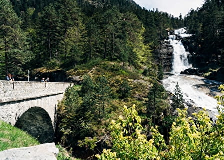 Waterfall and stone bridge