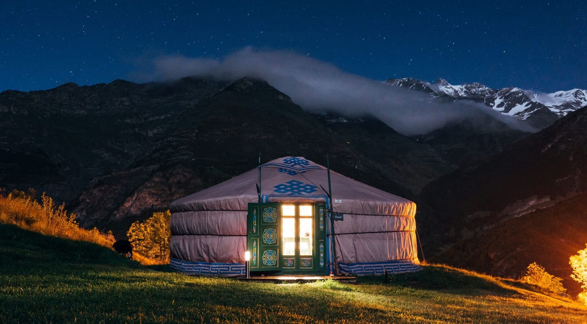 Yurt in the mountains at night