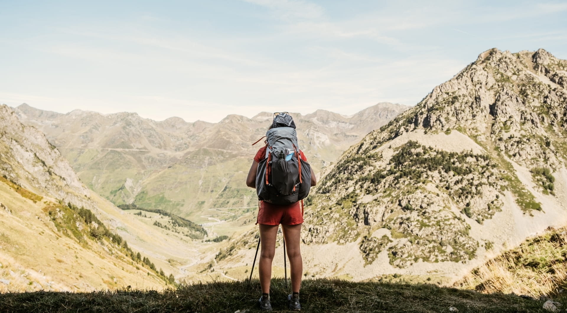 Woman hiking from behind